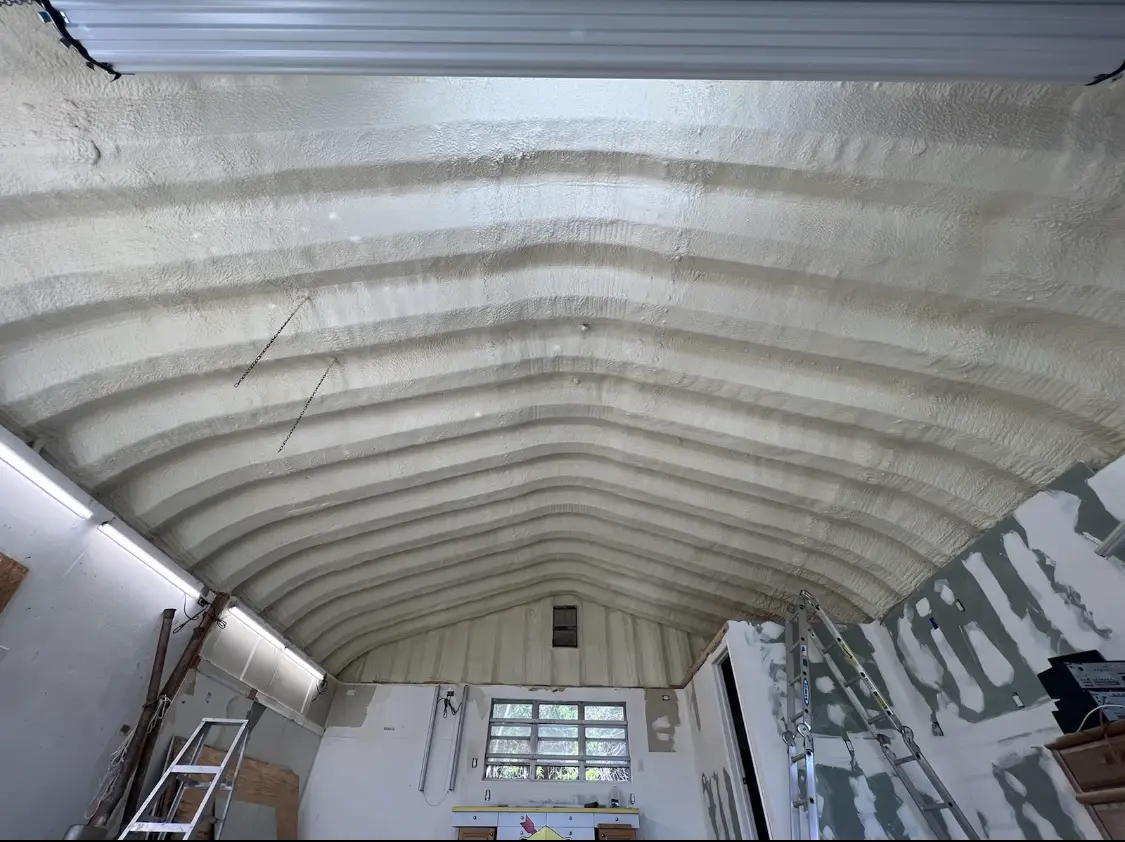 Spray polyurethane foam applied to the underside of a metal roof deck in Pinole